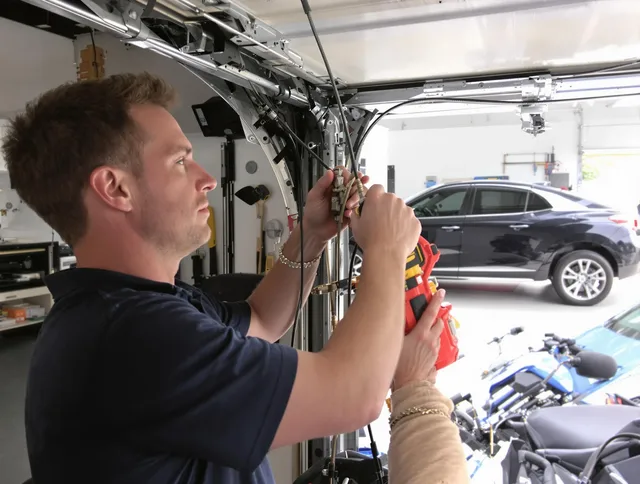 Palm Bay Garage Door Repair safety certified technician performing cable replacement in Palm Bay
