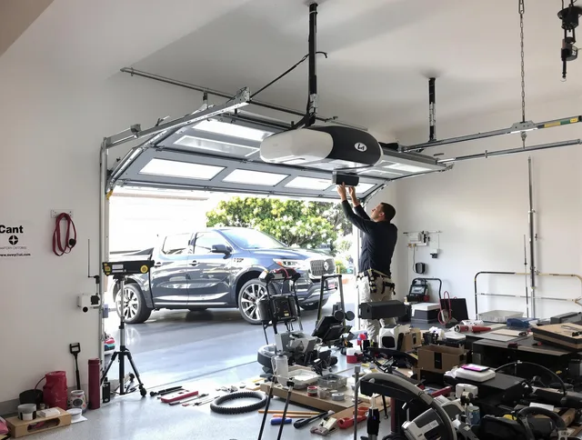 Palm Bay Garage Door Repair specialist installing smart garage door opener system in Palm Bay home